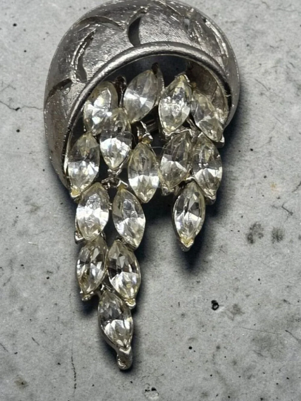 None this brooch
